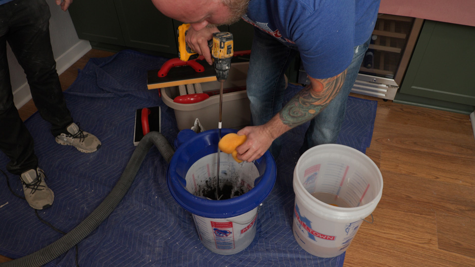 using the dustpro 360 to mix the grout with no mess or dust